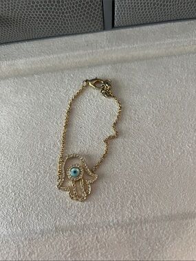 Gold Hamsa Hand Bracelet with Blue Evil Eye